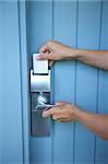 metal lock-card and handle on blue wood door