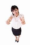 Young business woman of Asian give you double excellent sign, full length portrait isolated over white.
