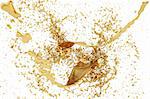 splash of golden fluid on the wall. isolated on white. with clipping path.