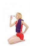 Pretty fitness woman drinking water after training exercises. isolated on white background