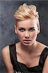 close up portrait fashion of young blond girl with creative hair stylish on dark background