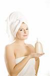 pretty woman with body lotion in bath towel