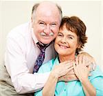 Loving portrait of good looking couple in their early sixties.