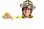 Friendly fireman in uniform, pointing to blank white space, ready for your message.