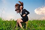 Outdoor Fashion businesswoman tossing her hair in air