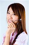 Friendly Customer Representative with headset smiling during a telephone conversation