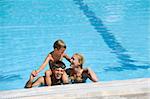 happy father and son have fun at swimming pool