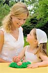 Young mother and daughter having Easter time