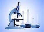 Laboratory metal microscope and test tubes with liquid toning in blue color