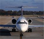 Modern passenger jet on the ground front view