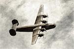 World War II era heavy American bomber on old scratched photo