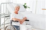 Senior woman in her wheelchair looking at the camera