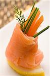 photo fo delicious  smoked salmon rolls with tomatoes inside