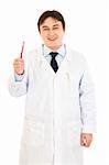 Smiling dentist holding toothbrush in hand isolated on white