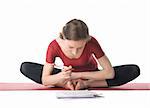 Young woman in sports clothes working with documents