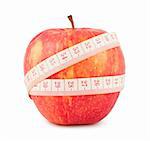 Tape measure wrapped around the red apple isolated on white