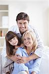 Young attractive family home on the couch