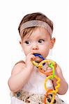 Portrait of Baby with vibrant chain toy isolated