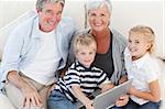 Adorable family looking at their laptop