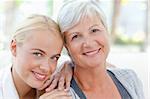 Lovely woman with her mother at home