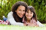 Adorable mother with her daughter in the garden