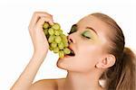 Pretty young woman with grape closeup on the white background