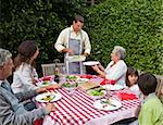 Man serving his family at the table