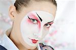 close-up artistic portrait of japan geisha woman with creative make-up