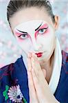 japan geisha woman with creative make-up .close-up artistic portrait
