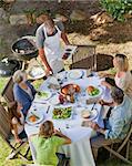 Lovely family eating in the garden