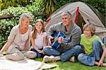 Happy family camping in the garden