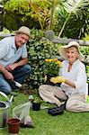 Mature couple working in the garden