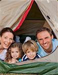 Joyful family camping in the garden