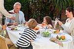 Family eating in the garden