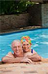 Happy mature couple in the swimming pool