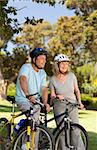 Senior couple mountain biking outside