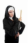 Young, angry Catholic nun lwith ruler in hand on a white background