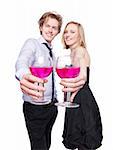 Young couple toasting with pink drink. Selective Focus. Studio photo, isolated.