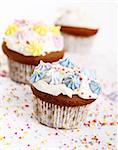 Holiday cupcakes decorated with colorful flowers