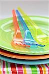 colorful plastic tableware  and napkins for picnics