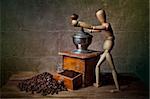 Still Life with Coffee grinder and jointed doll working the mill