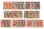 7 days of week (first 3 letters) in vintage wood letterpress printing blocks, isolated on white