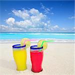 beach cocktails yellow red in caribbean tropical turquoise sea sand