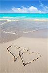 hearts in love written in Caribbean beach sand tropical aqua sea