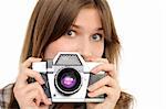 Pretty woman taking photo with vintage camera