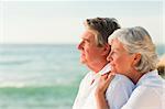 Woman hugging her husband at the beach