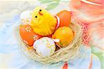 Easter eggs  and chicken in a nest