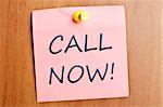 Call now post it on wooden wall