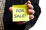 For sale post it in business man hand