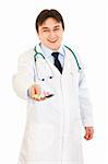 Smiling medical doctor holding packs of pills in hand isolated on white